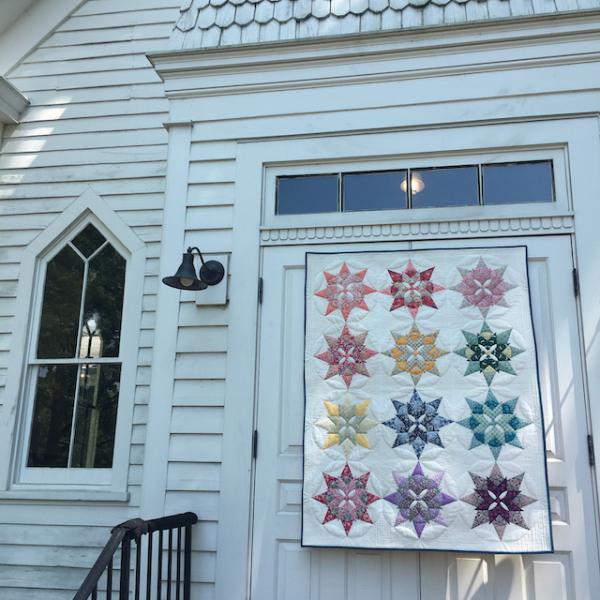 Brimfield Awakening Blooming star by church door